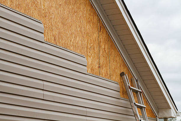Professional Siding technician working in Louisburg, NC